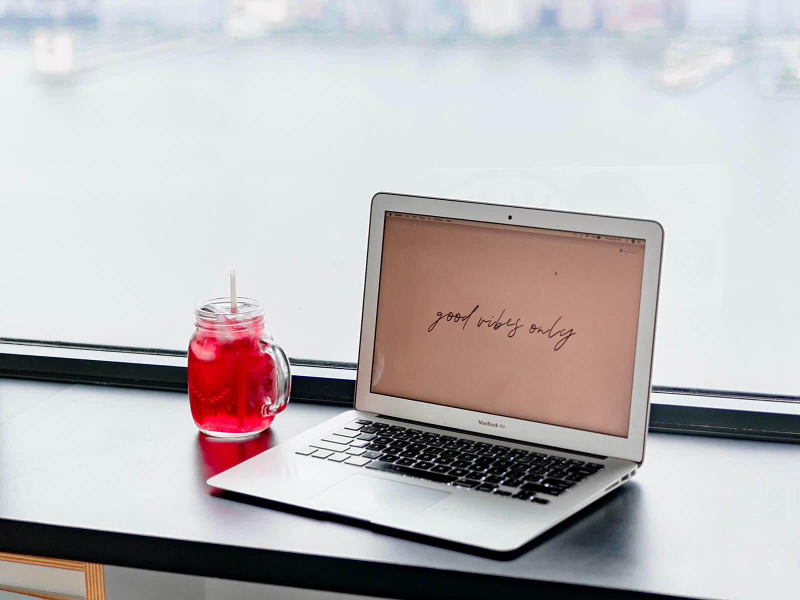 Blogger's notebook with red drink